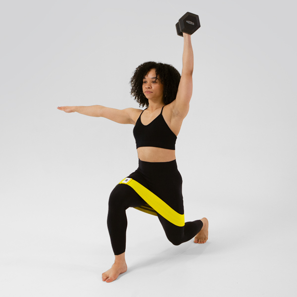 Woman holding weight over head with resistance band