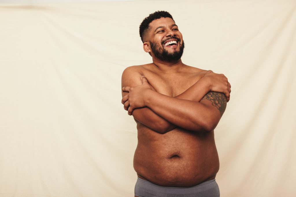 Man,With,Pot,Belly,Embracing,His,Natural,Body.,Happy,Young